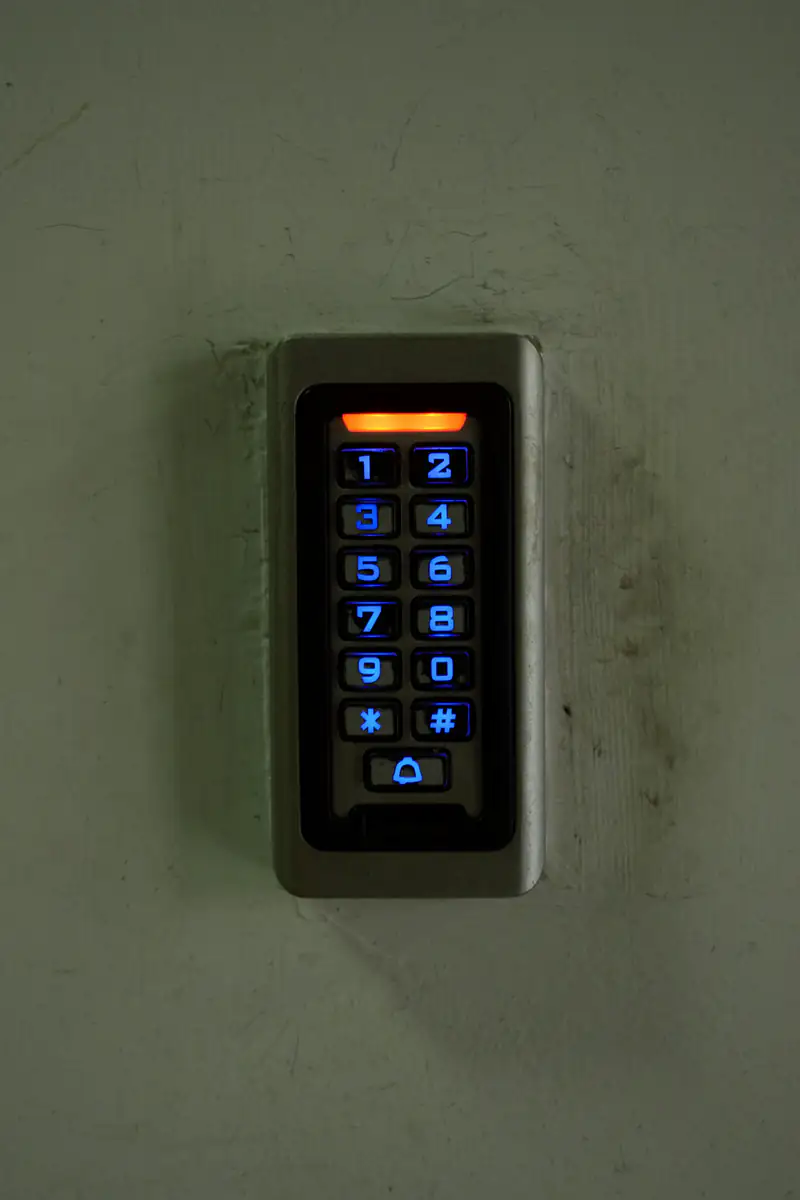 Illuminated security keypad at a building entrance